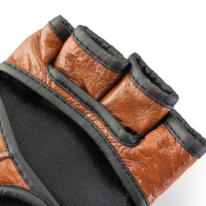 <strong>Nasze rękawice MMA w stylu Retro, wykonane ze skóry naturalnej, to połączenie klasyki z nowoczesnością, zapewniające nie tylko ochronę, ale i wyjątkowy komfort podczas każdego treningu.</strong> Rękawice MMA ze skóry naturalnej Retro Tan Evolution RM-130 - Evolution