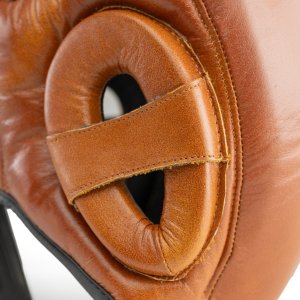 <span style="font-size: 14pt;"><span style="color: #000000;"><span style="font-family: Calibri, sans-serif;">Kask</span></span><span style="color: #000000;"><span style="font-family: Calibri, sans-serif;"> bokserski z najwyższej jakości skóry naturalnej, ten kask nie tylko gwarantuje niezrównaną ochronę, ale również odzwierciedla tradycyjny styl sztuk walki.</span></span></span> Kask bokserski ze skóry naturalnej Retro Tan Evolution L OG-140 - Evolution